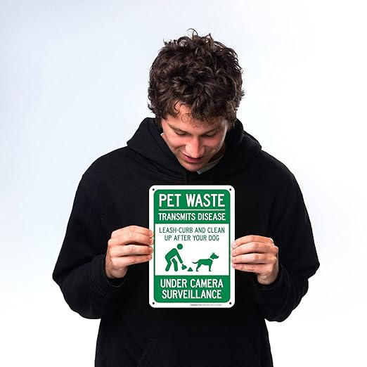 Pet Waste Leash-Curb and Clean Up After Your Dog Under Camera Surveillance Sign, (SI-63188) 10x7 Inches, Rust Free .040 Aluminum, Fade Resistant, Made in USA